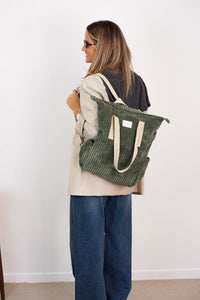 DE LA MUR Corduroy Backpack-Shoulder Bag in olive green, carried on the shoulder by a model