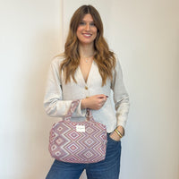 Model with the DE LA MUR Geometric Jacquard Extra Large Makeup Bag – Pink & Lilac (Nana)