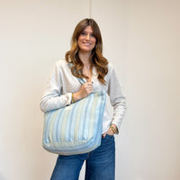Model with the DE LA MUR Striped Jacquard Large Zippered Tote Bag – Blue & Green (Cata)