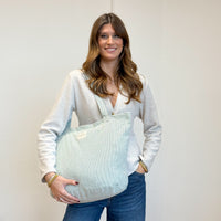 Model with the DE LA MUR Striped Large Zippered Tote Bag – Light Green & Green (Teo)