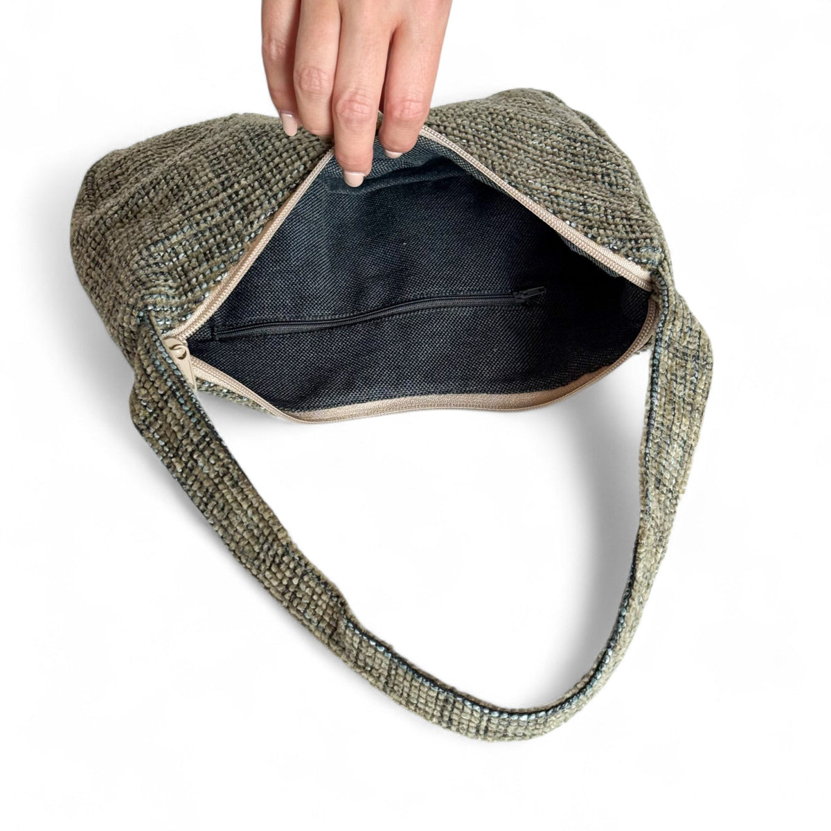 Open DE LA MUR Musa shoulder bag showing dark lined interior with zip pocket