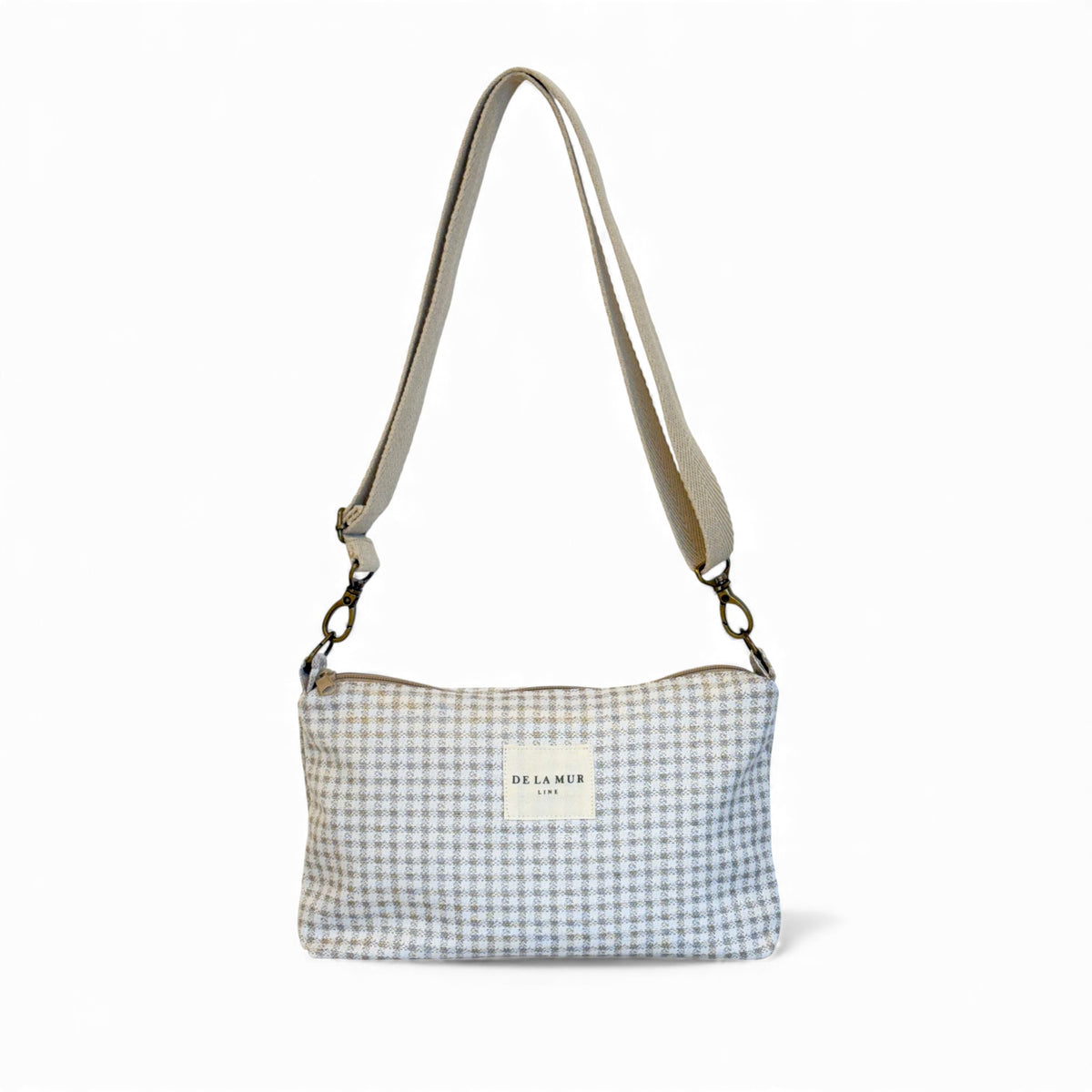 DE LA MUR Vison gingham jacquard clutch bag in beige and off-white, front view with strap