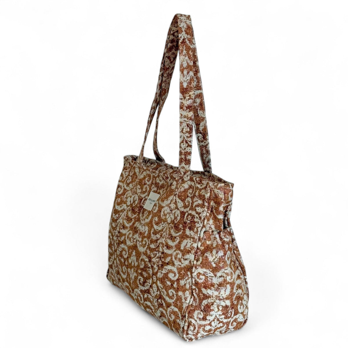 DE LA MUR rust jacquard tote bag, three-quarter side view showing side pocket