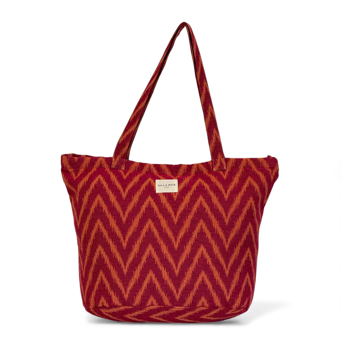 DE LA MUR Fuego zigzag jacquard tote in pink and orange, front view
