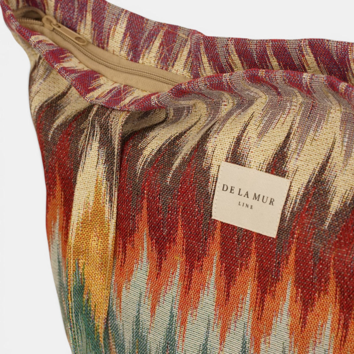 Open DE LA MUR Guana zippered bag showing the zipper and woven Line label inside