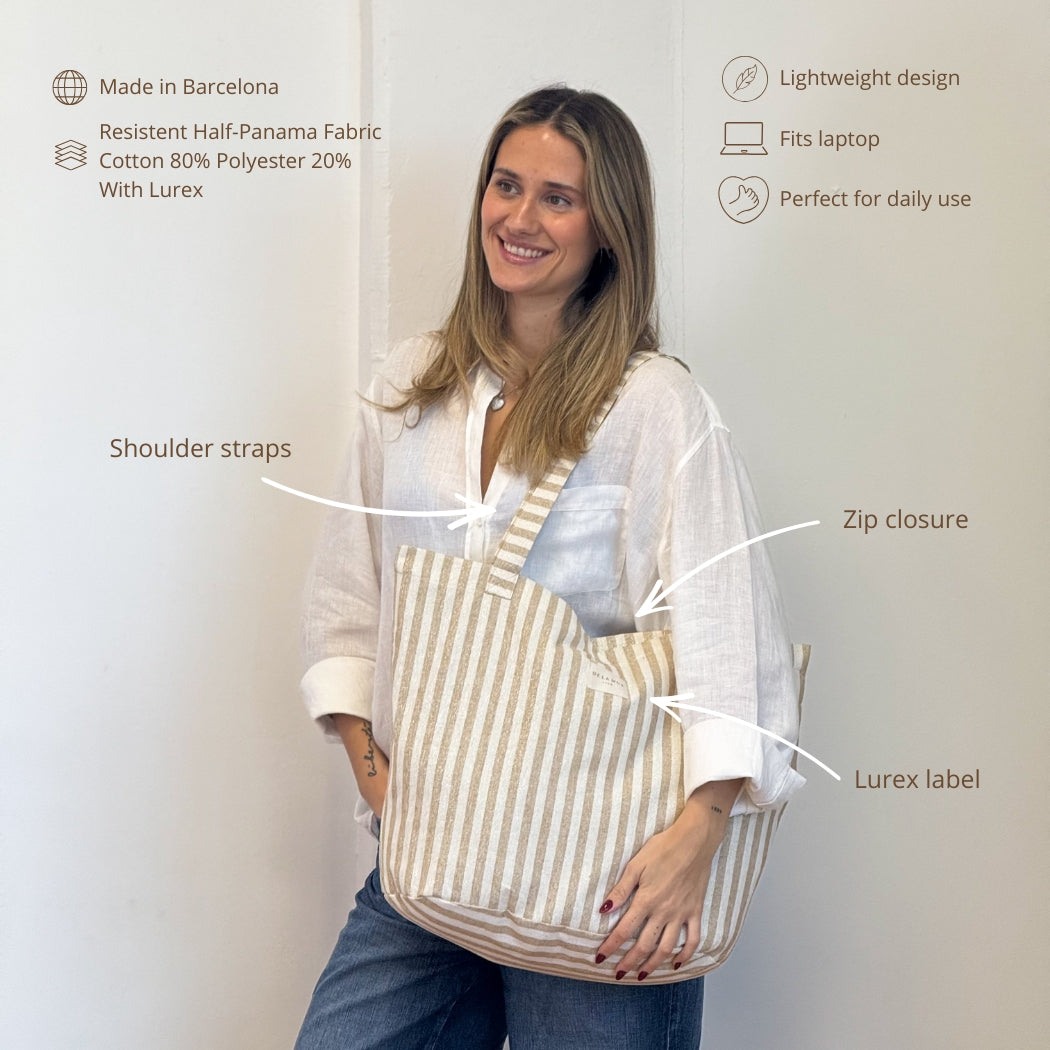 Model holding the DE LA MUR mustard striped tote bag, features infographic