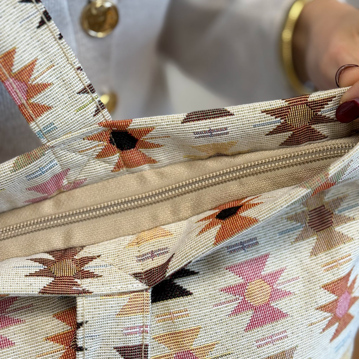 Detail of the open zip closure on the DE LA MUR Royal jacquard tote bag