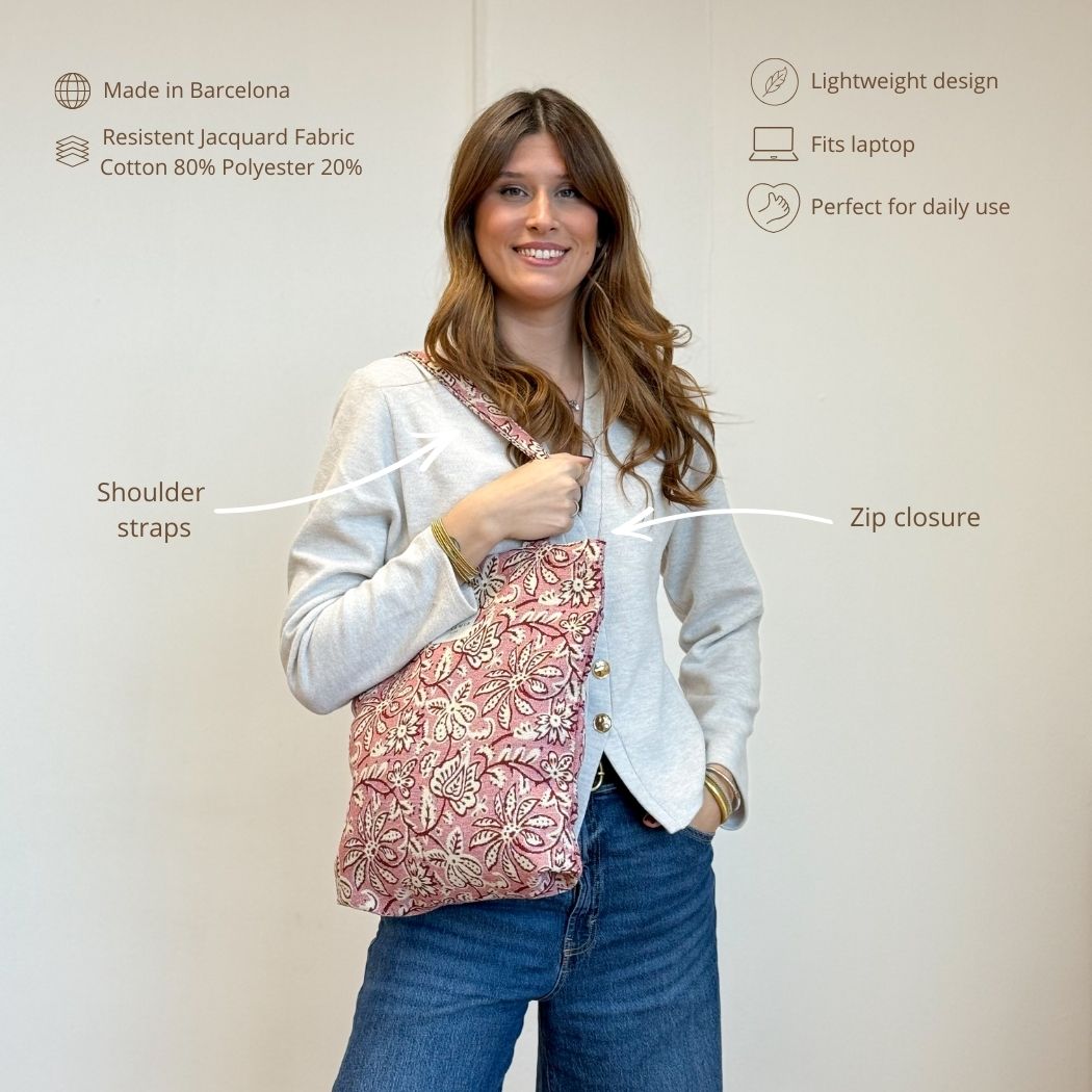 Open DE LA MUR pink floral bag showing zip closure and inner label