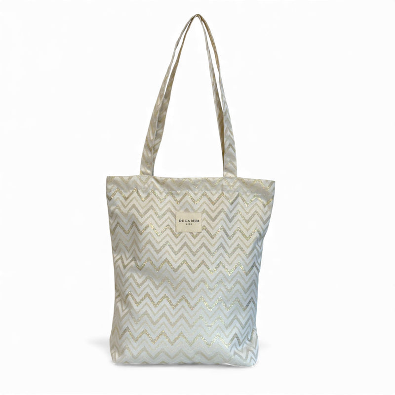 DE LA MUR zigzag zippered bag in gold and off-white, front view