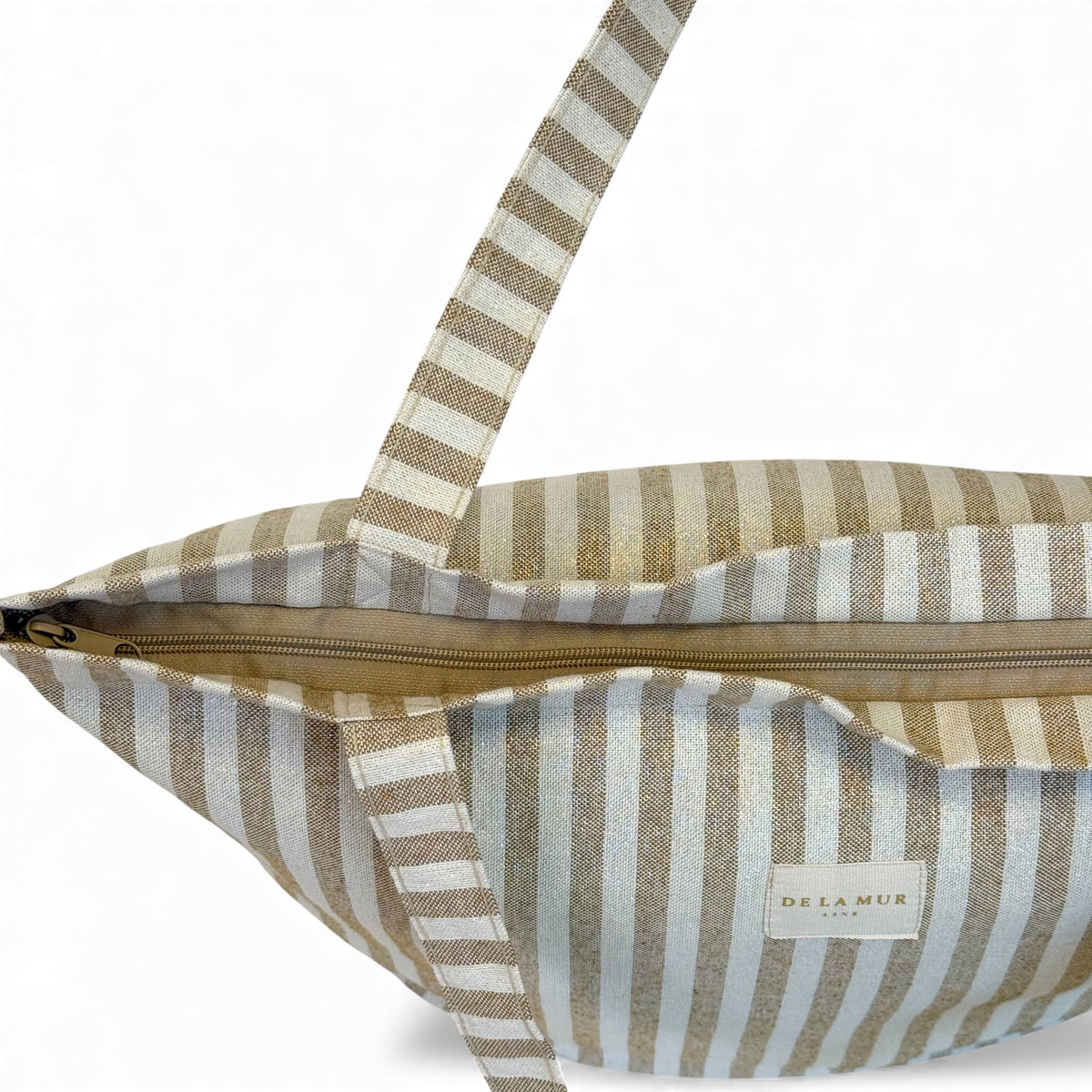Open DE LA MUR Lumos bag showing zip closure and lined interior