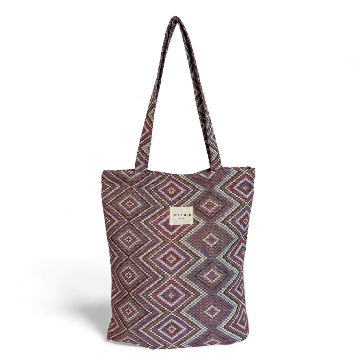 DE LA MUR Nana geometric jacquard zippered bag in pink and lilac, front view