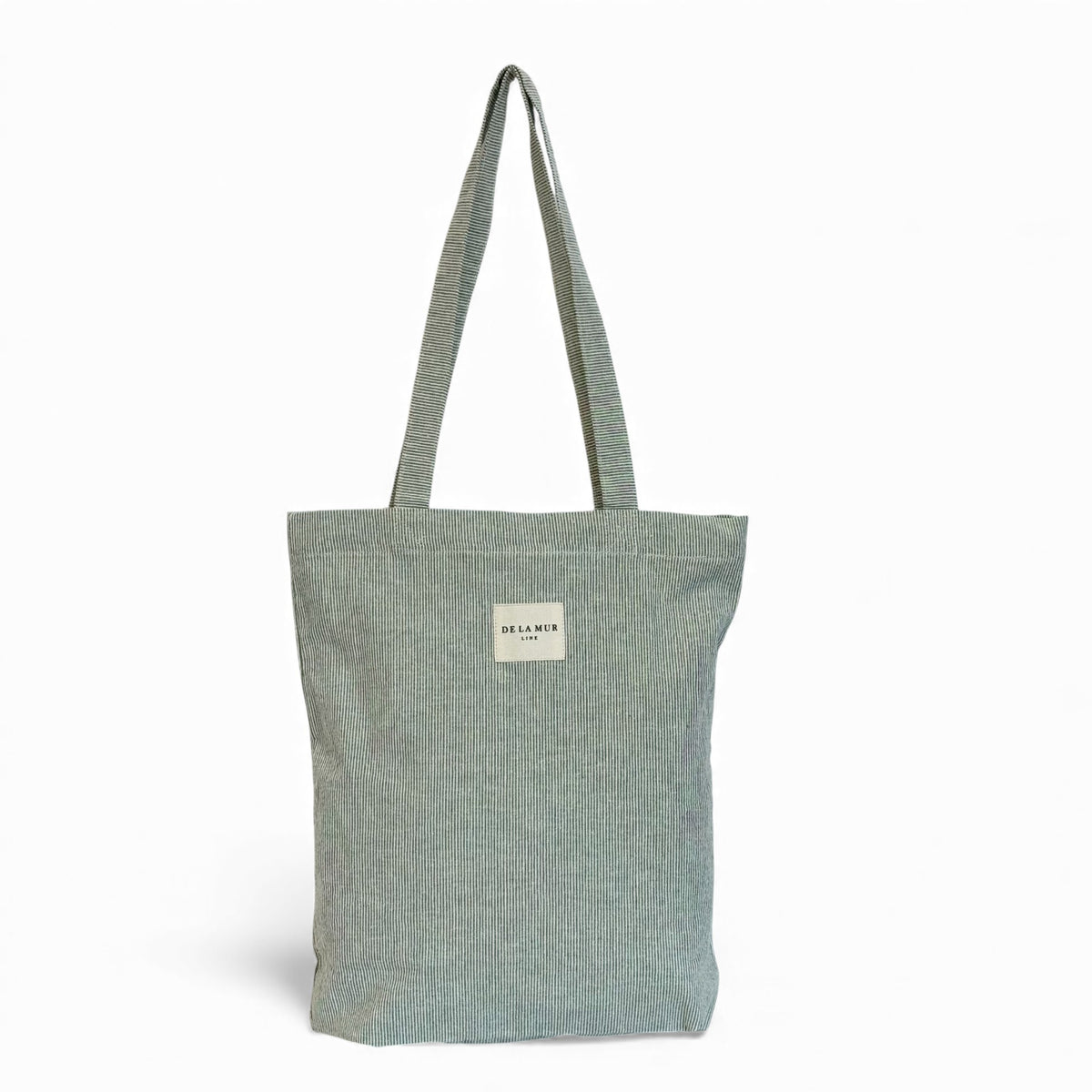 DE LA MUR Teo striped zippered tote bag in light green, front view