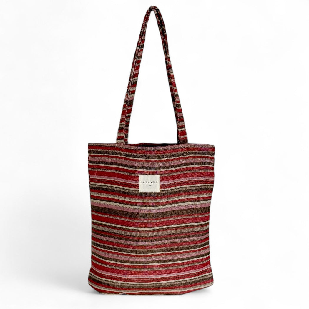 DE LA MUR Pita striped jacquard tote bag in pink and red tones, front view