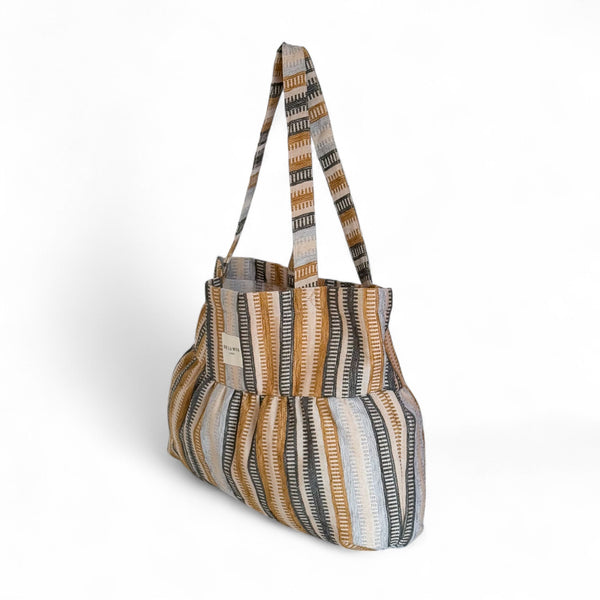 DE LA MUR Tron striped jacquard ruffle tote bag, three-quarter side view