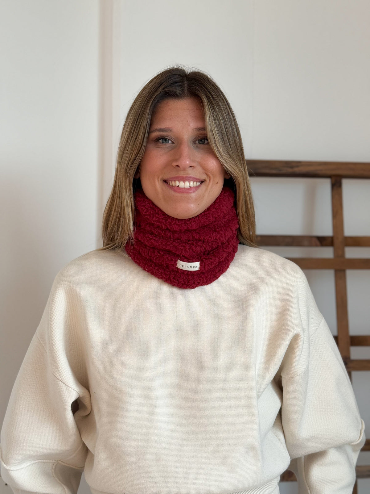 Close-up of the DE LA MUR Burgundy sherpa neck warmer (Lake)
