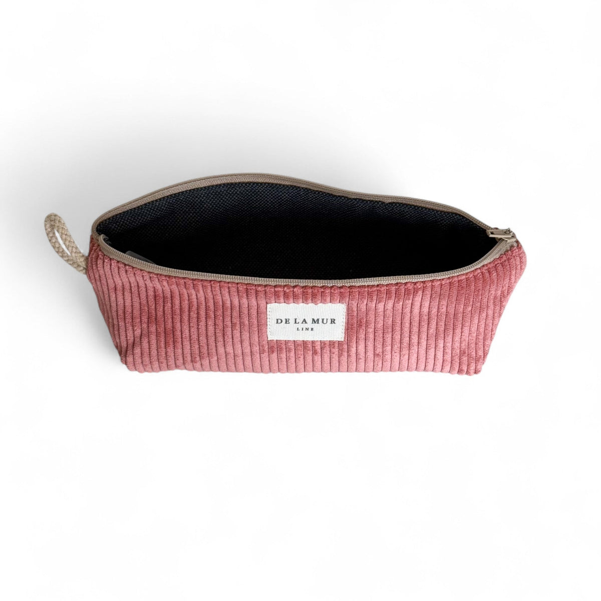 Open DE LA MUR Coral corduroy pencil case showing black lined interior