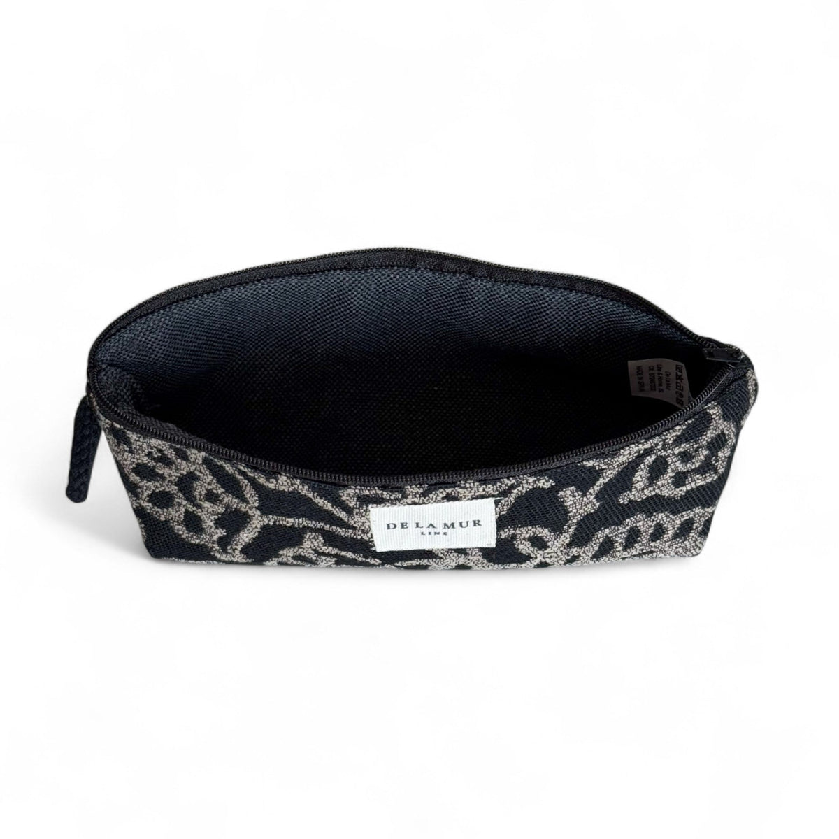 Open DE LA MUR Teide jacquard pencil case showing black lined interior