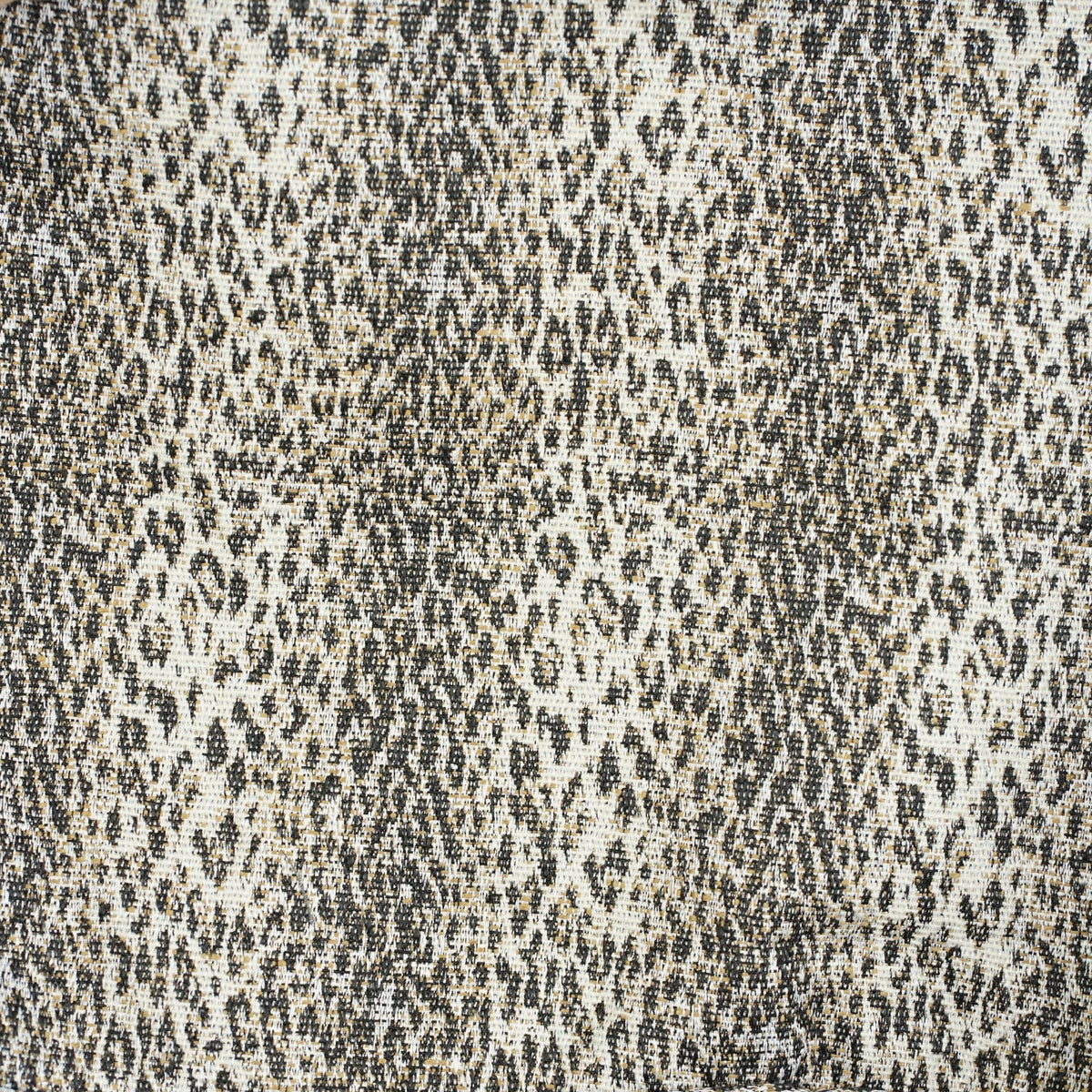 Close-up of the beige and black leopard jacquard fabric of the DE LA MUR Leo bag