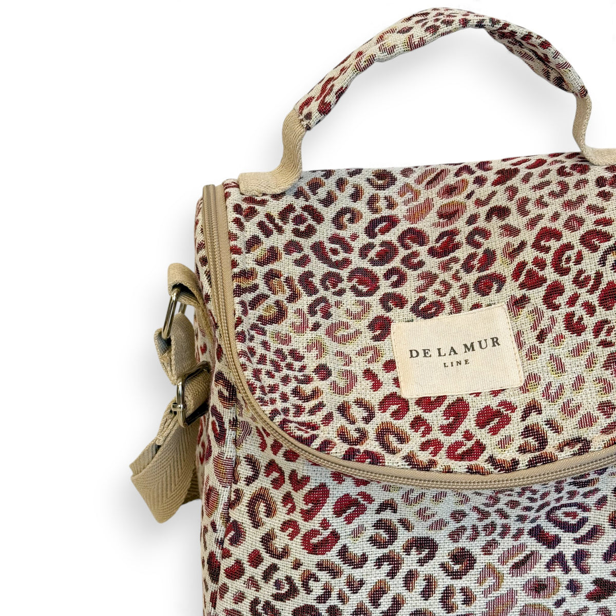 Close-up of the Talco leopard jacquard fabric and DE LA MUR Line label