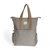 DE LA MUR Sydney herringbone backpack in beige with front pocket, front view