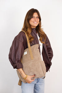 DE LA MUR Corduroy Backpack-Shoulder Bag in taupe beige, carried on the shoulder by a model