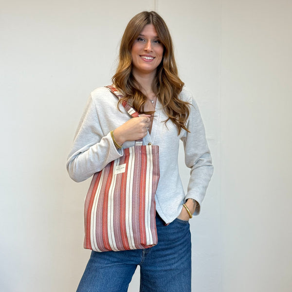 Model with the DE LA MUR Striped Jacquard Medium Zippered Tote Bag – Burgundy & Cream (Make)