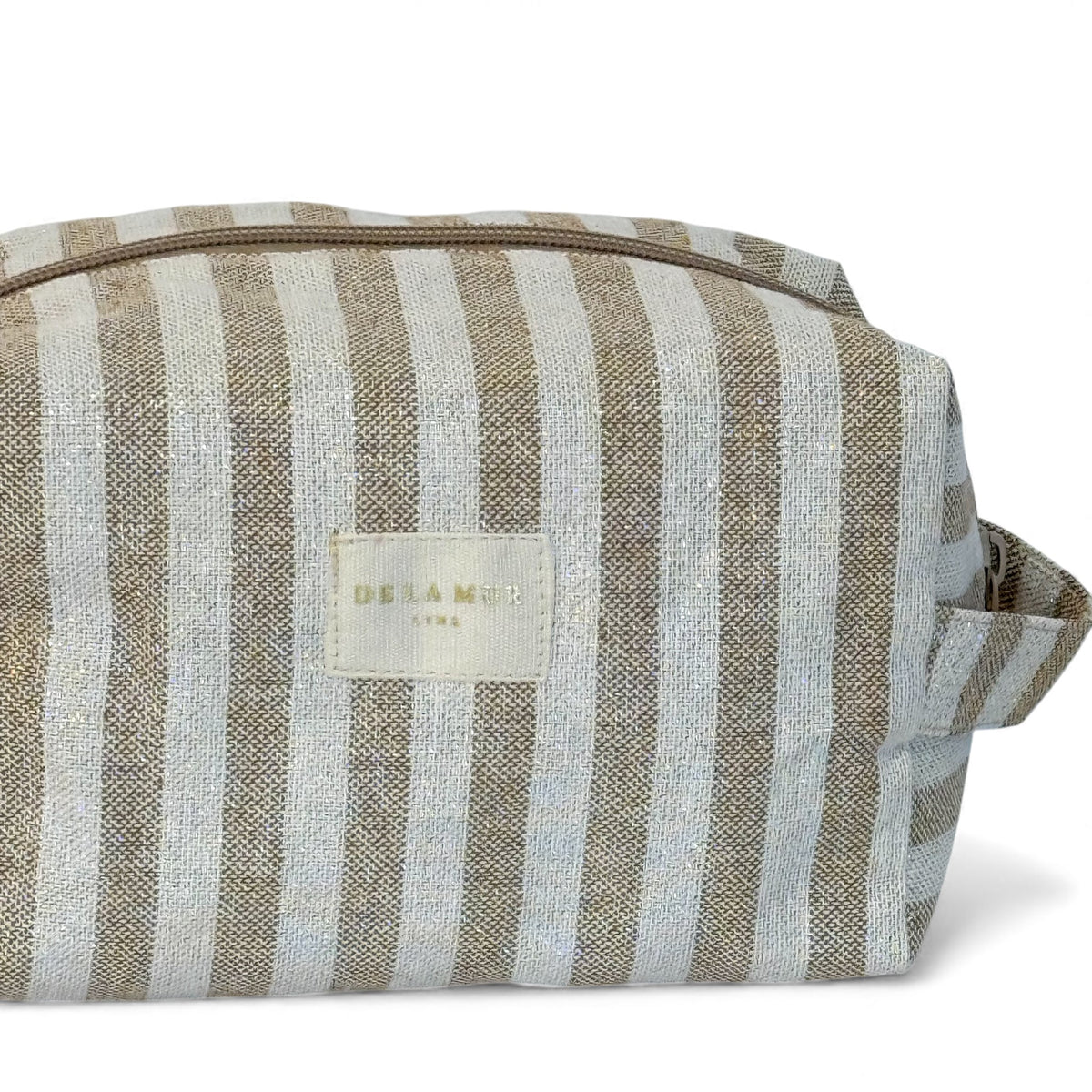 Side view of the DE LA MUR Lumos ecru and mustard striped makeup bag