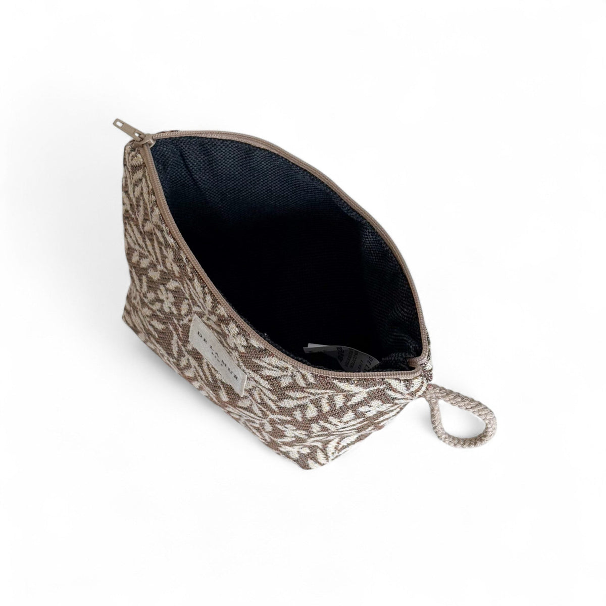 Open DE LA MUR Plan floral makeup bag showing the dark lined interior