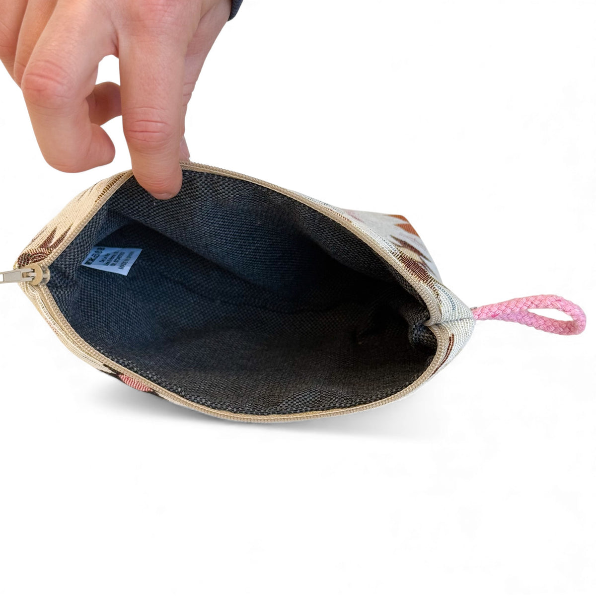 Open DE LA MUR Royal makeup bag showing the dark lined interior