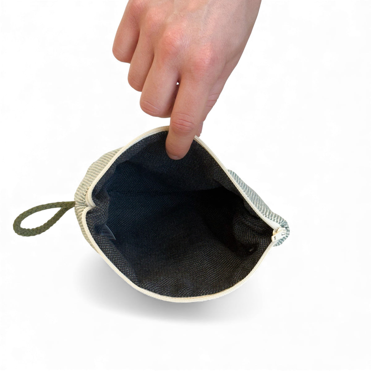 Open DE LA MUR Teo striped makeup bag showing the dark lined interior