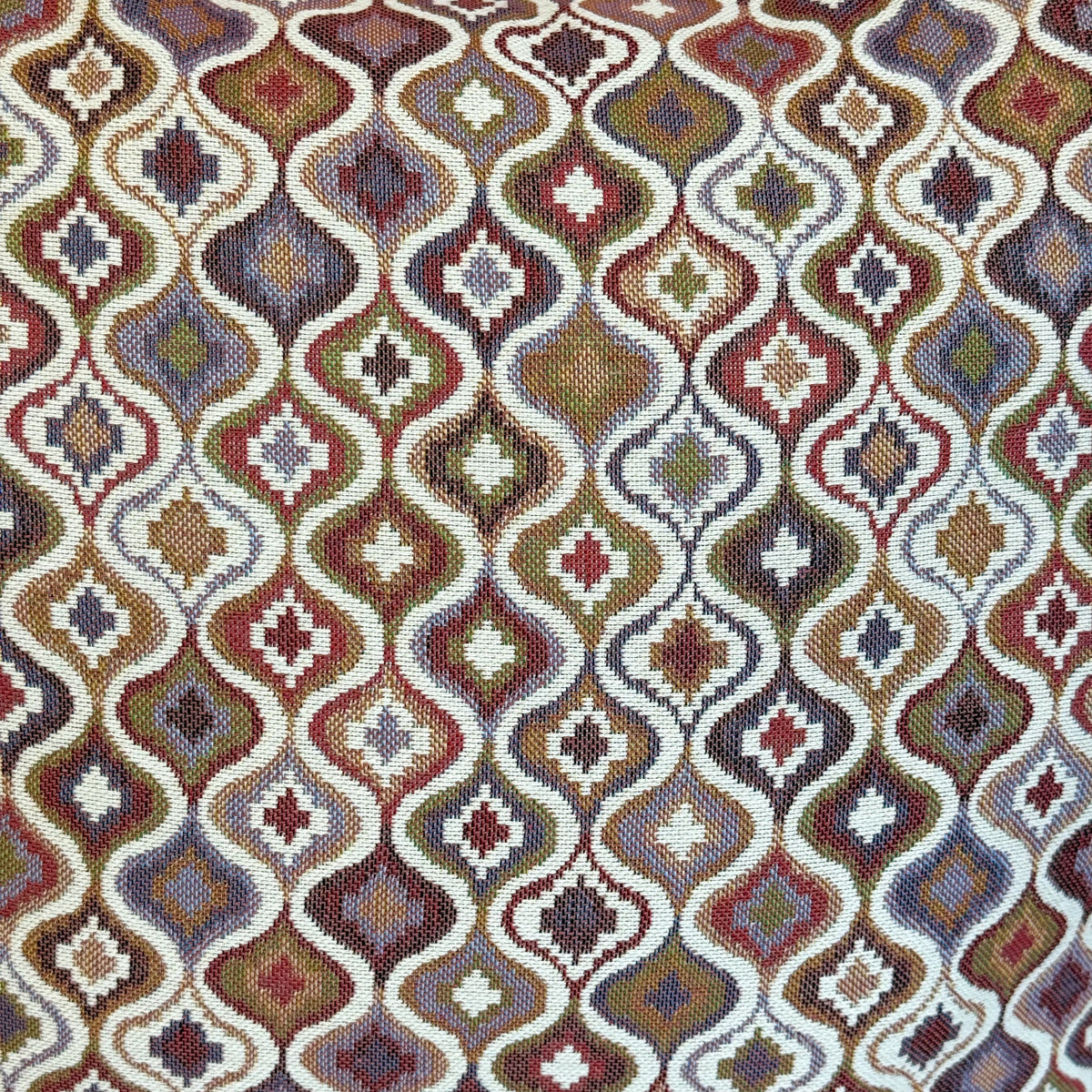 Close-up of the pink and lilac ogee jacquard weave on the DE LA MUR Onda bag