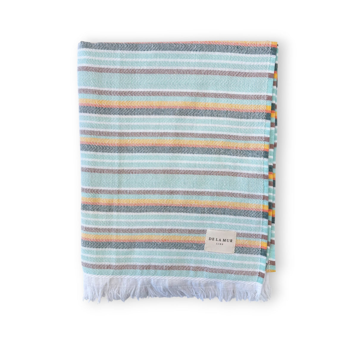 DE LA MUR striped towel in aqua and multicolor, folded with fringed edge, front view